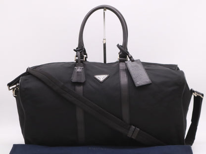PRADA Nylon Triangle Logo Boston Bag in Black. Includes dust bag, name tag, crochet, padlock, and two keys.