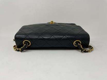 CHANEL CHANEL Mini Matelasse Shoulder Bag with Gold Hardware, Lambskin Coco Mark, and Turn Lock.