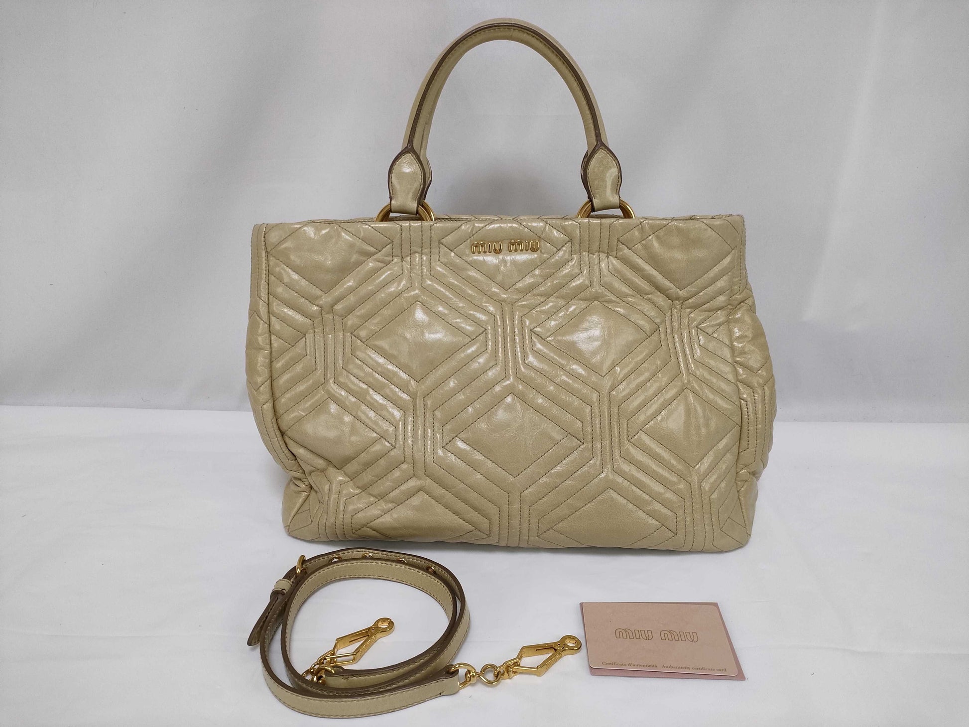 Miu Miu Miu 2-way handbag/shoulder bag in beige quilted leather.