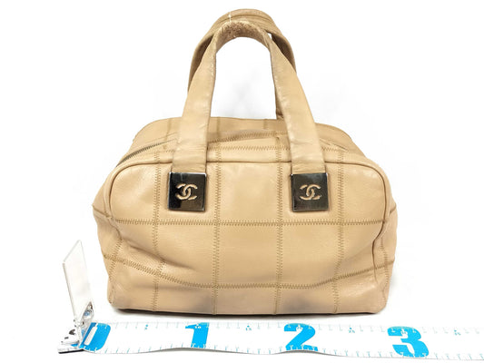 CHANEL Caviar Skin Handbag with Coco Mark and Silver Hardware, Beige