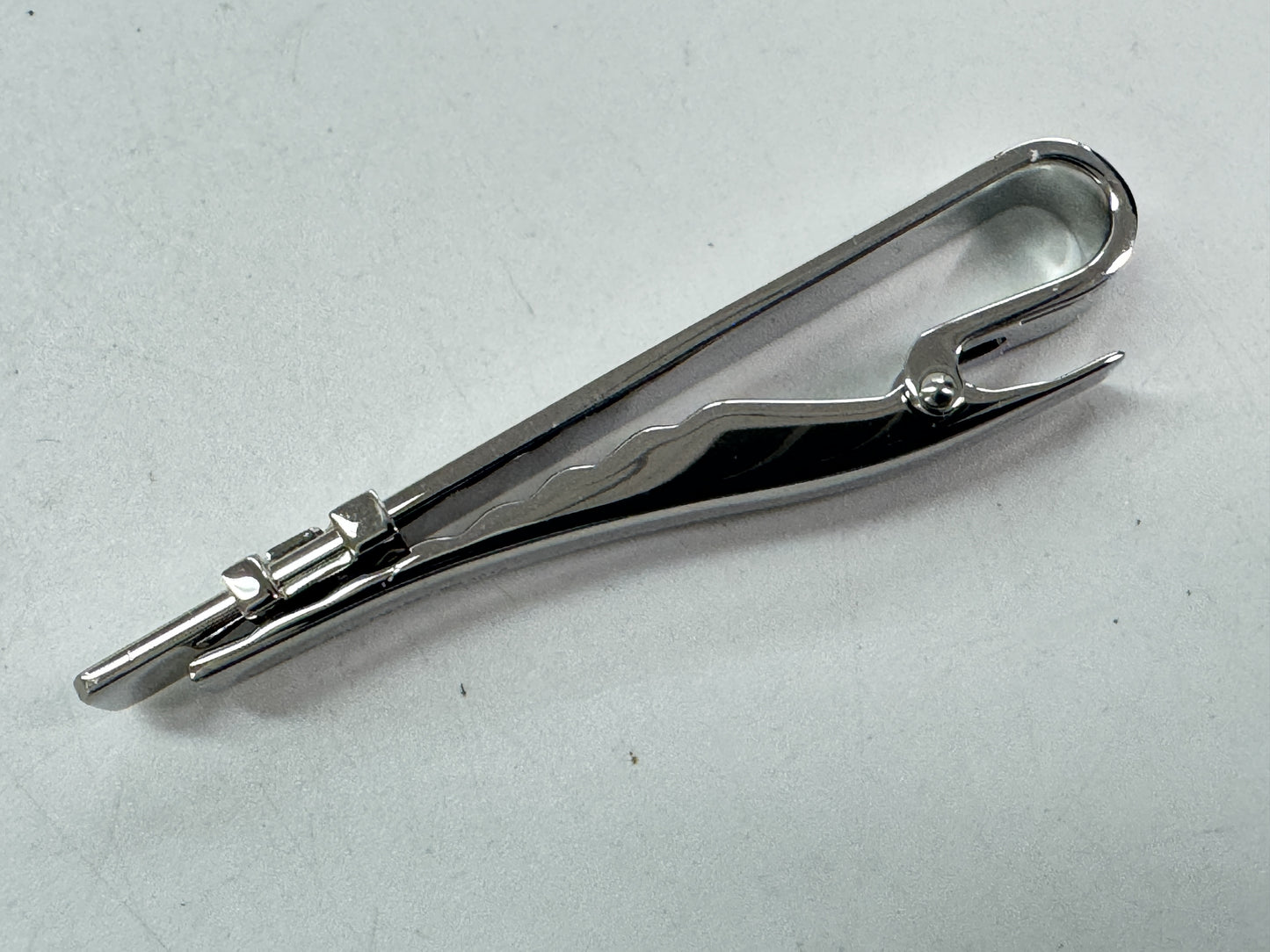 LOUIS VUITTON Monogram cufflinks and tie clip.