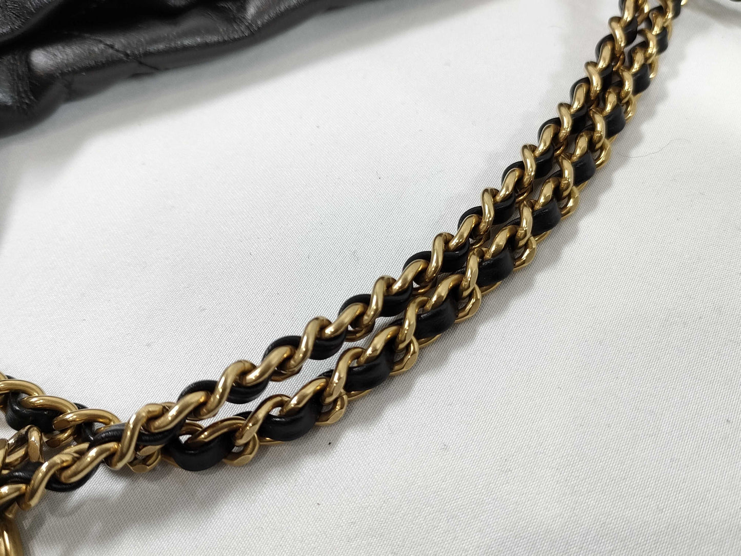 CHANEL CHANEL 22 Shiny Calfskin Chain Shoulder Bag with Gold Hardware and Serial Number Plate in Black