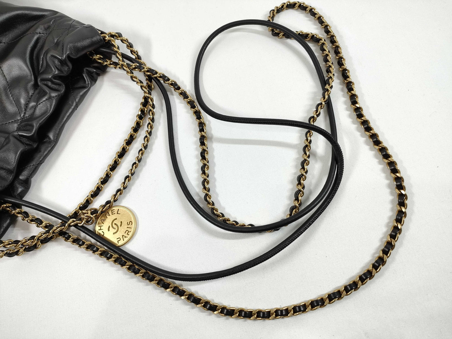 CHANEL CHANEL 22 Shiny Calfskin Chain Shoulder Bag with Gold Hardware and Serial Number Plate in Black