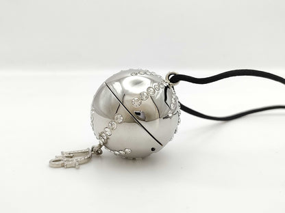 Dior logo mirror ball necklace with rhinestones and lip gloss.
