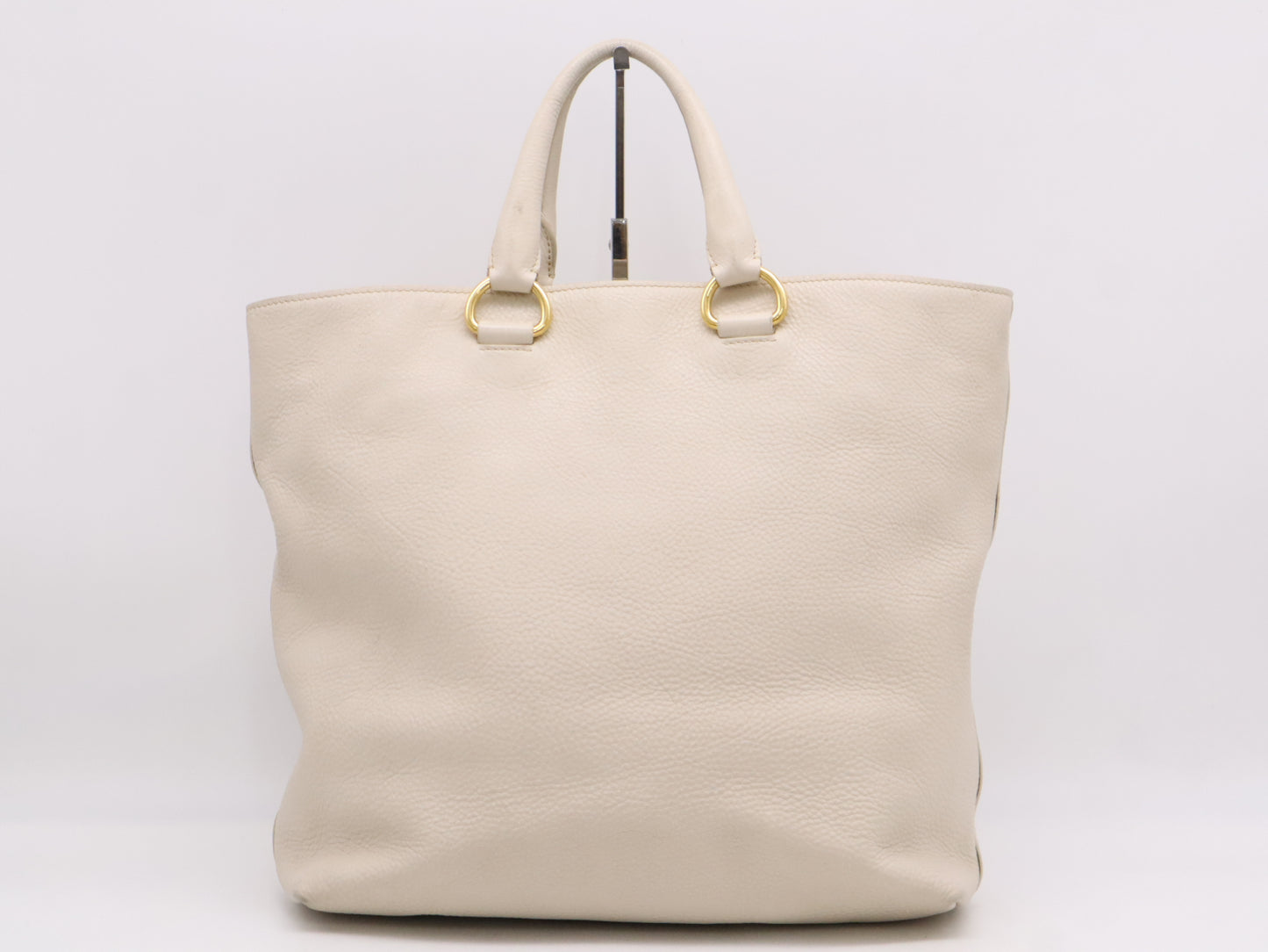 PRADA 2-way leather tote bag in white with GD hardware, shoulder strap, and name tag.