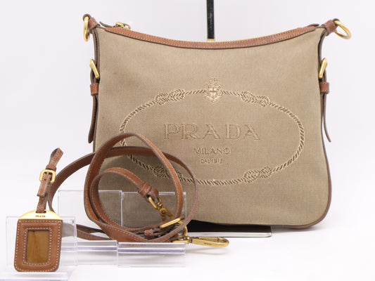 PRADA Leather Jacquard Logo Shoulder Bag in Beige and Brown with GD Hardware, Shoulder Strap, and Name Tag