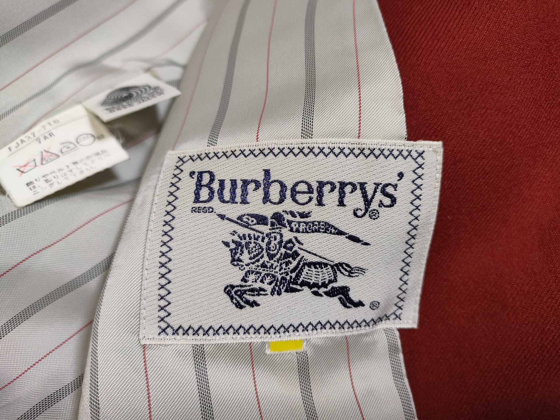 Burberry Navy Blazer with Horse Embroidery and Gold Buttons.