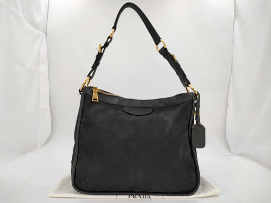 PRADA Tessuto nylon and leather one-shoulder bag with name tag