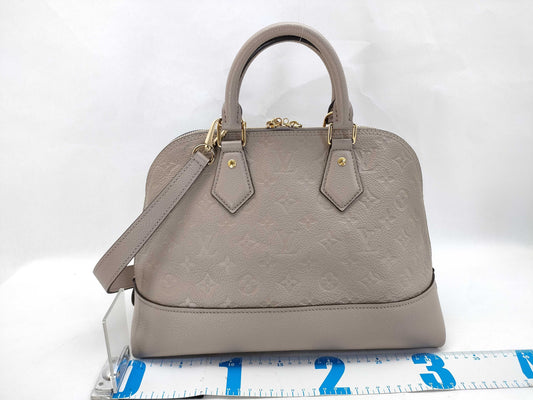 LOUIS VUITTON Monogram Empreinte Louis Vuitton Neo Alma Empreinte Handbag