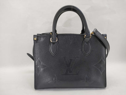 LOUIS VUITTON Monogram Empreinte Louis Vuitton On the Go PM Empreinte Handbag