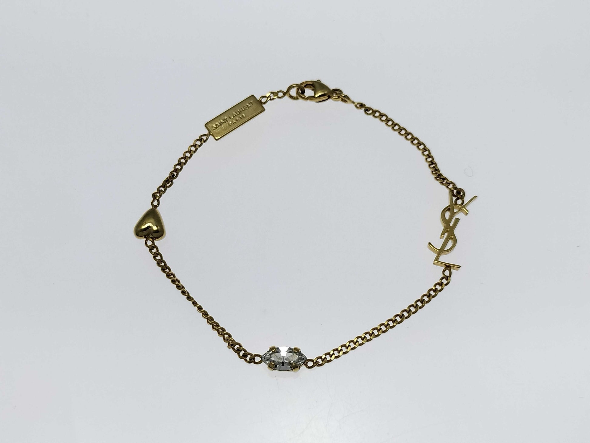 Yves Saint Laurent YSL Logo Cassandra Heart Charm Bracelet in Gold with Rhinestones. Includes Box and Dust Bag.