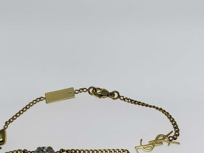 Yves Saint Laurent YSL Logo Cassandra Heart Charm Bracelet in Gold with Rhinestones. Includes Box and Dust Bag.