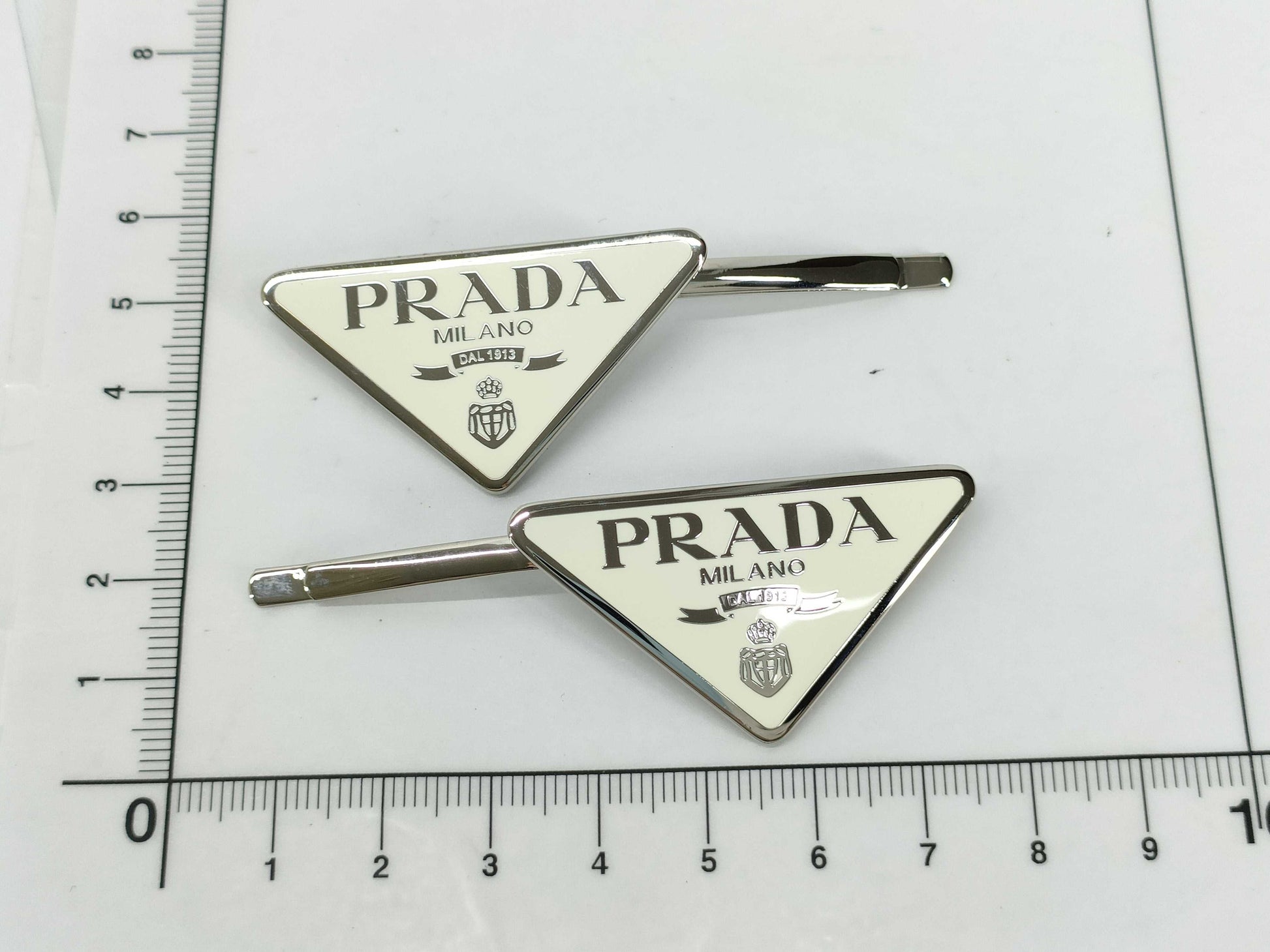 PRADA Prada Logo Hairpin. Accessories: Box, Dust Bag. Hair Accessory.