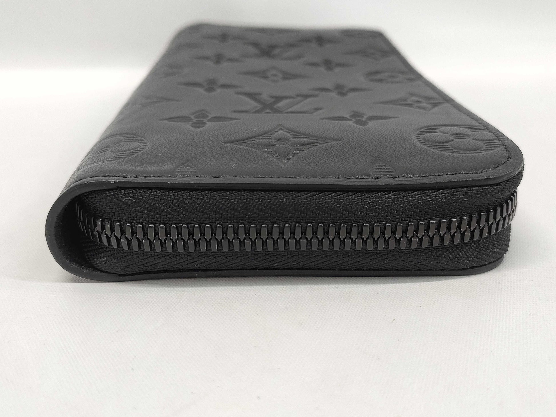 LOUIS VUITTON Zippy Wallet Vertical Monogram Shadow. Includes box, dust bag, and other original accessories. Brand new, unused wallet.