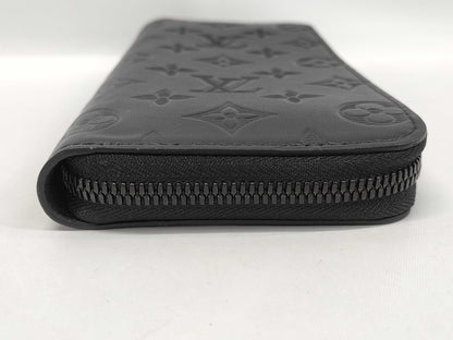 LOUIS VUITTON Zippy Wallet Vertical Monogram Shadow. Includes box, dust bag, and other original accessories. Brand new, unused wallet.