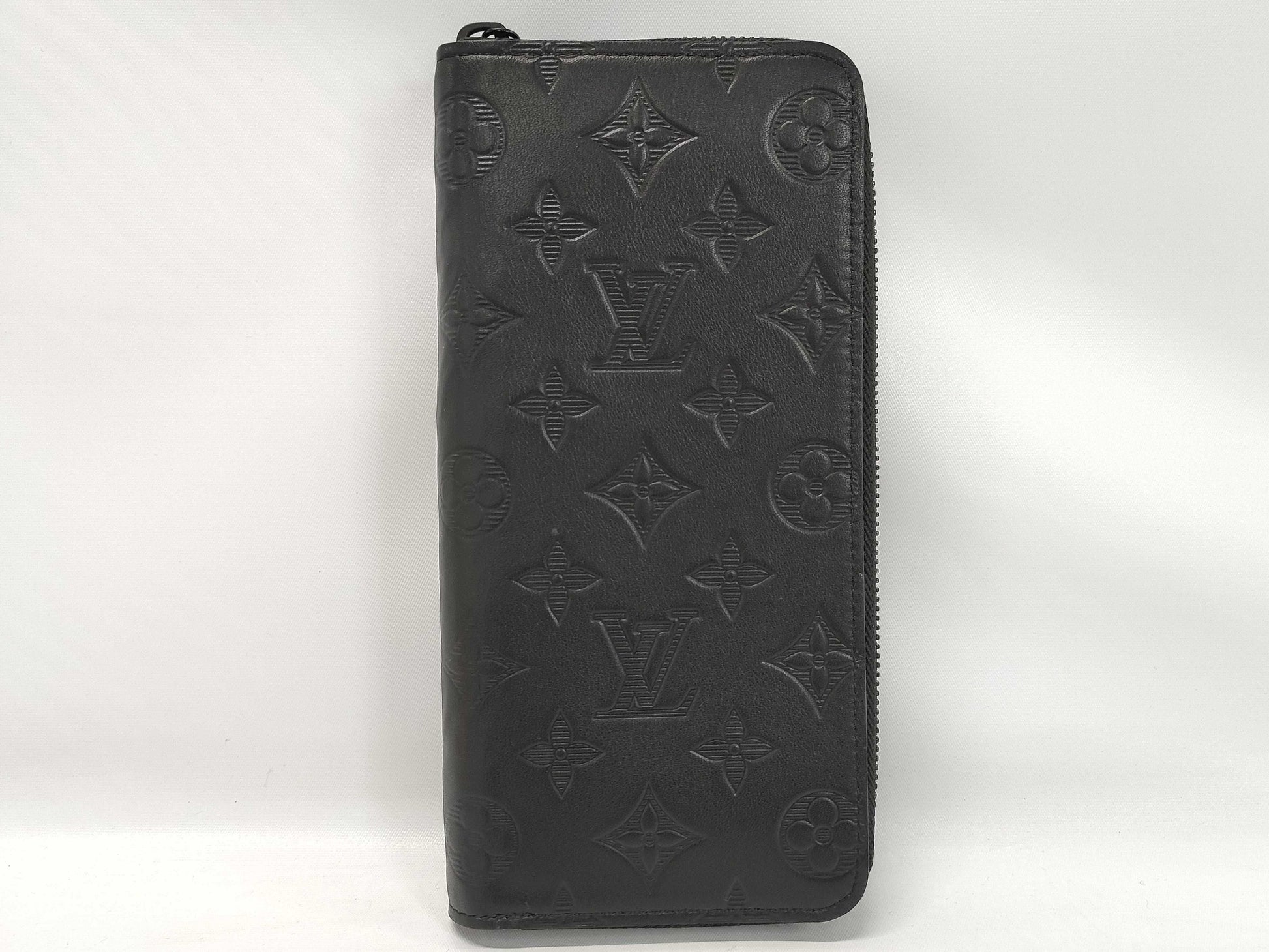LOUIS VUITTON Zippy Wallet Vertical Monogram Shadow. Includes box, dust bag, and other original accessories. Brand new, unused wallet.