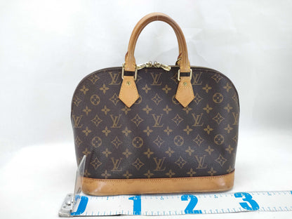LOUIS VUITTON Monogram Alma Handbag