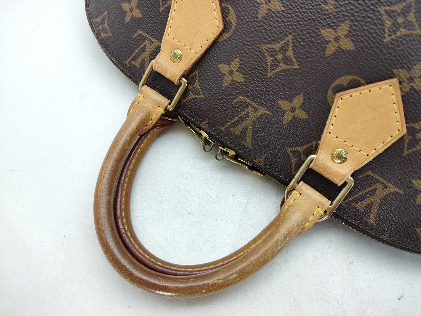 LOUIS VUITTON Monogram Alma Handbag