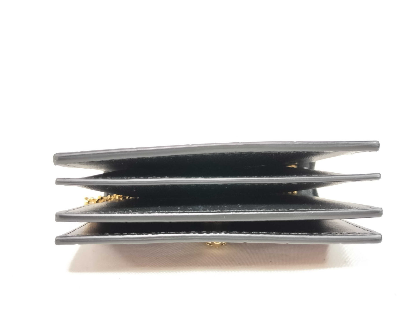 Excellent condition Alexander McQueen skull chain card case.