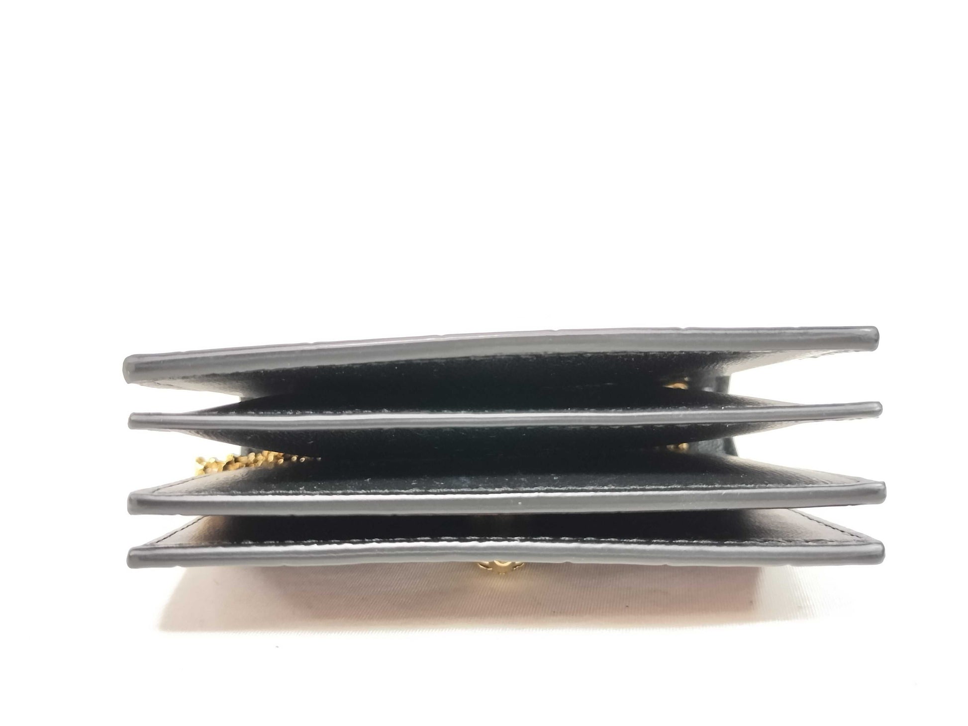 Excellent condition Alexander McQueen skull chain card case.