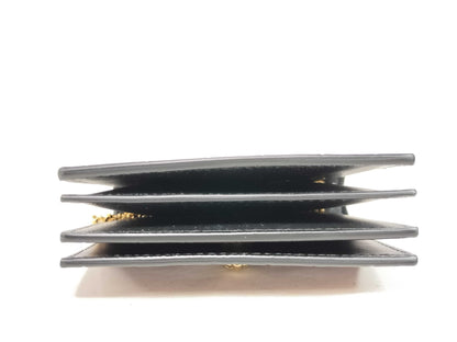 Excellent condition Alexander McQueen skull chain card case.