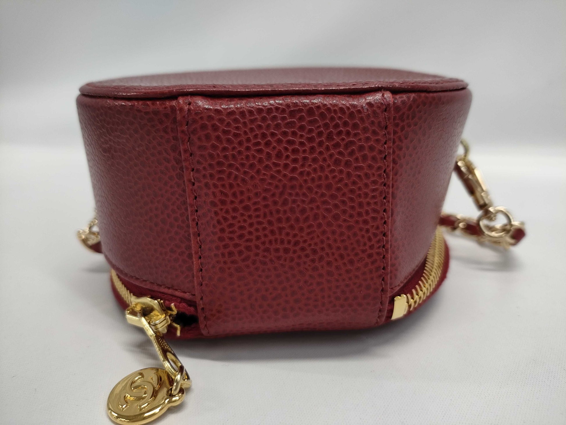 CHANEL Round Crossbody Pouch in Red Caviar Leather with Gold Hardware