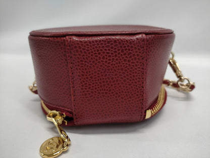 CHANEL Round Crossbody Pouch in Red Caviar Leather with Gold Hardware