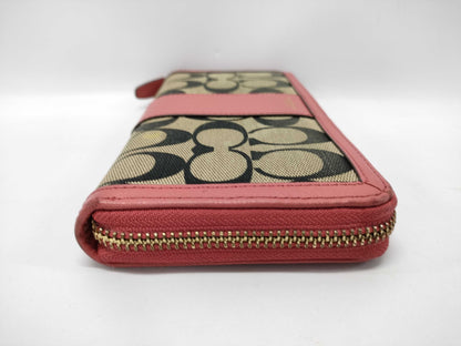 COACH Signature Zip-Around Canvas Leather Wallet in Beige and Pink