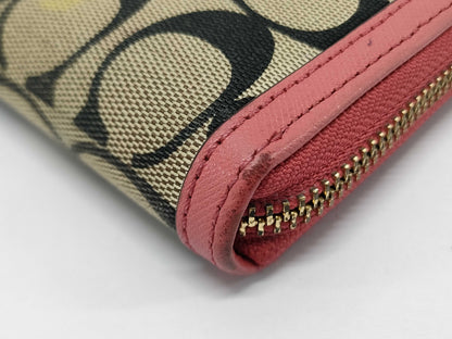 COACH Signature Zip-Around Canvas Leather Wallet in Beige and Pink