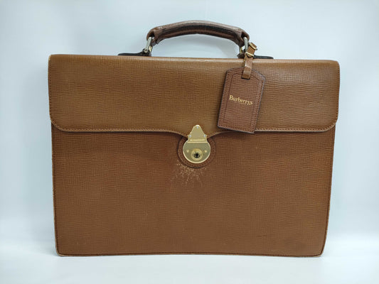 Burberry's Brown Leather Business Bag with Name Tag and Key
