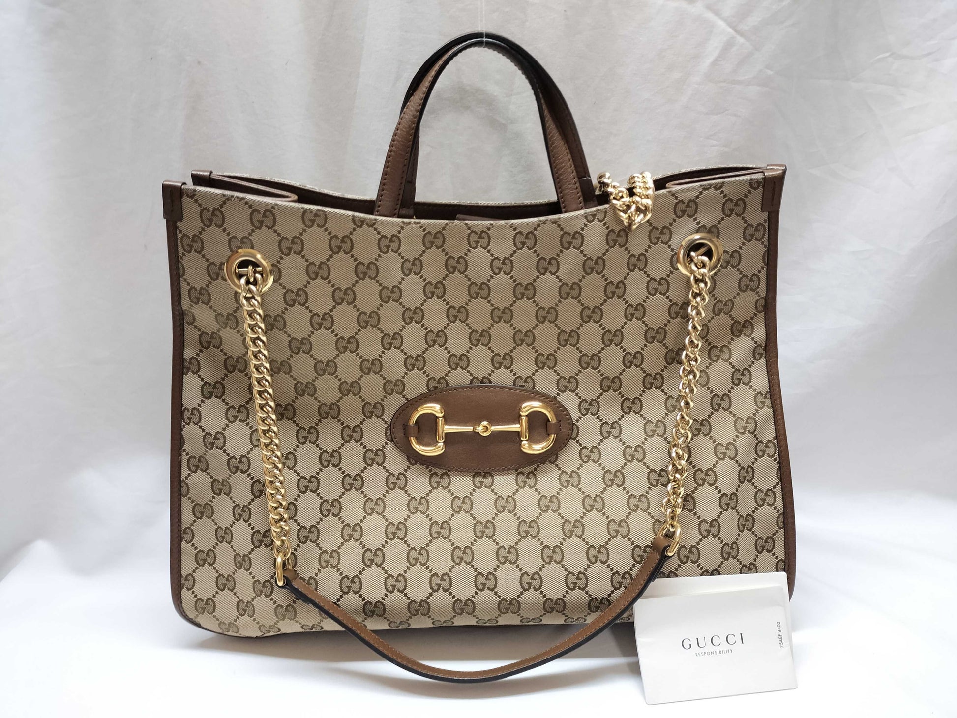 GUCCI GG Supreme Horsebit 1955 2-way tote bag in beige, brown, and gold hardware. GG canvas shoulder bag.