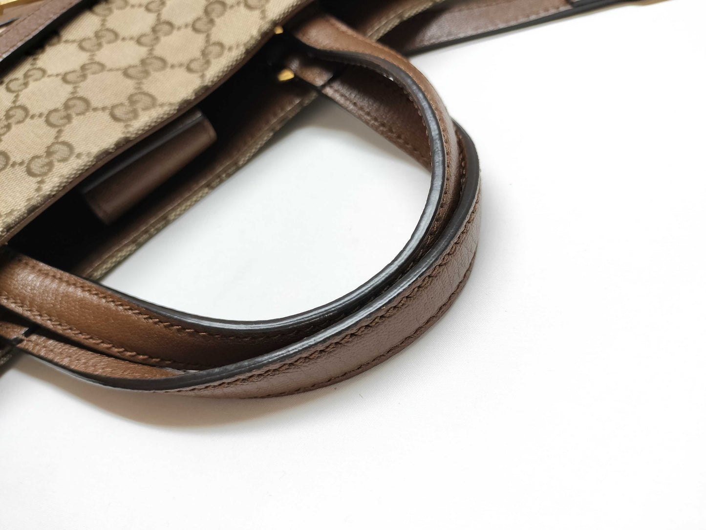 GUCCI GG Supreme Horsebit 1955 2-way tote bag in beige, brown, and gold hardware. GG canvas shoulder bag.