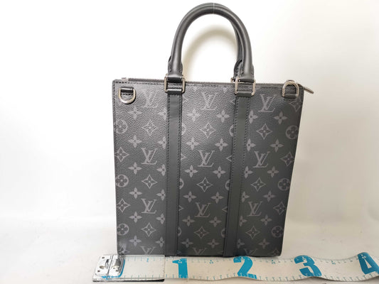 LOUIS VUITTON Monogram Eclipse Sack Pla Cross Handbag