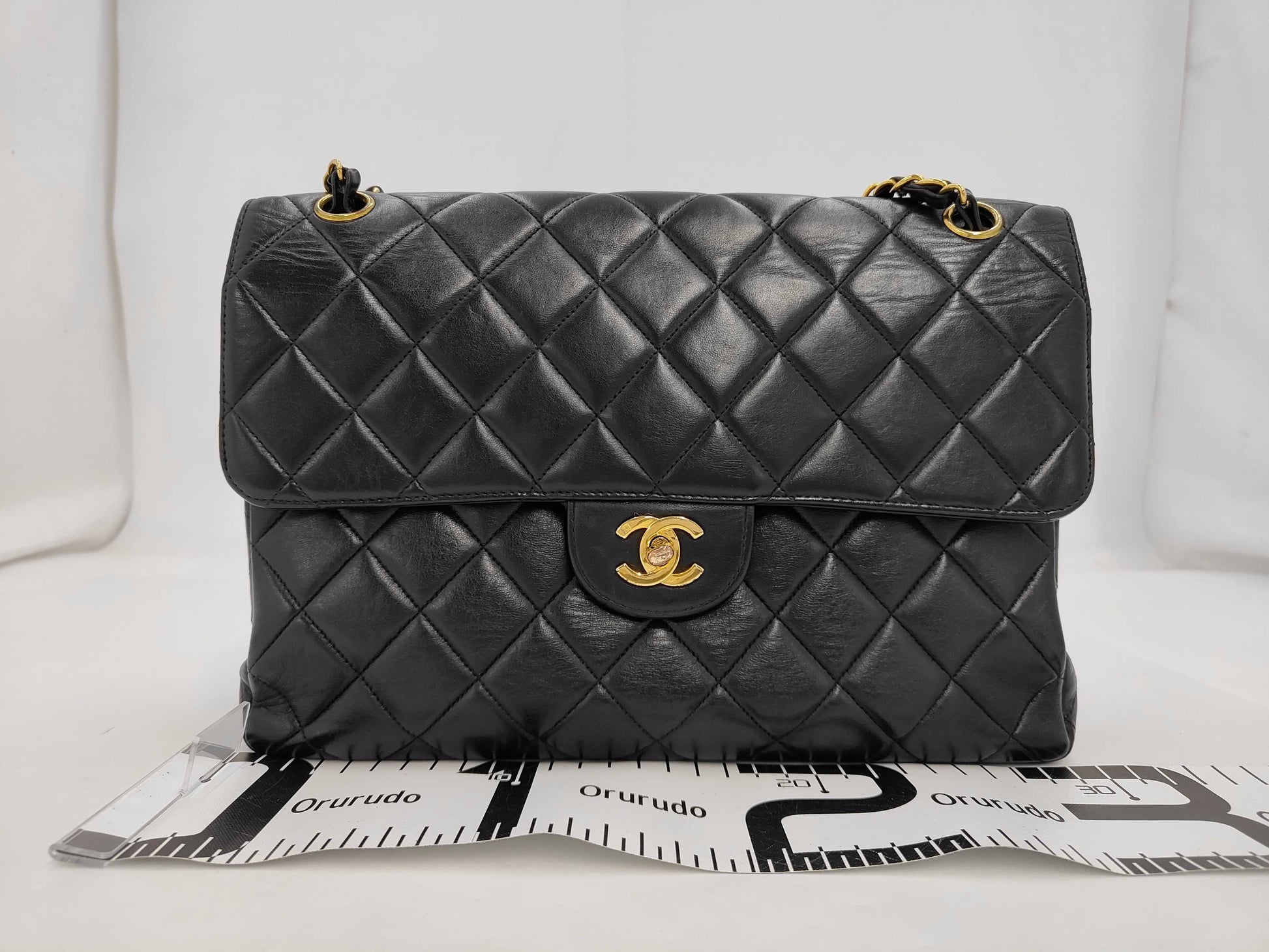 CHANEL Chain Shoulder Bag in Black and Gold