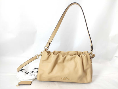 COACH Faye Drawstring Shoulder Bag in Beige Leather
