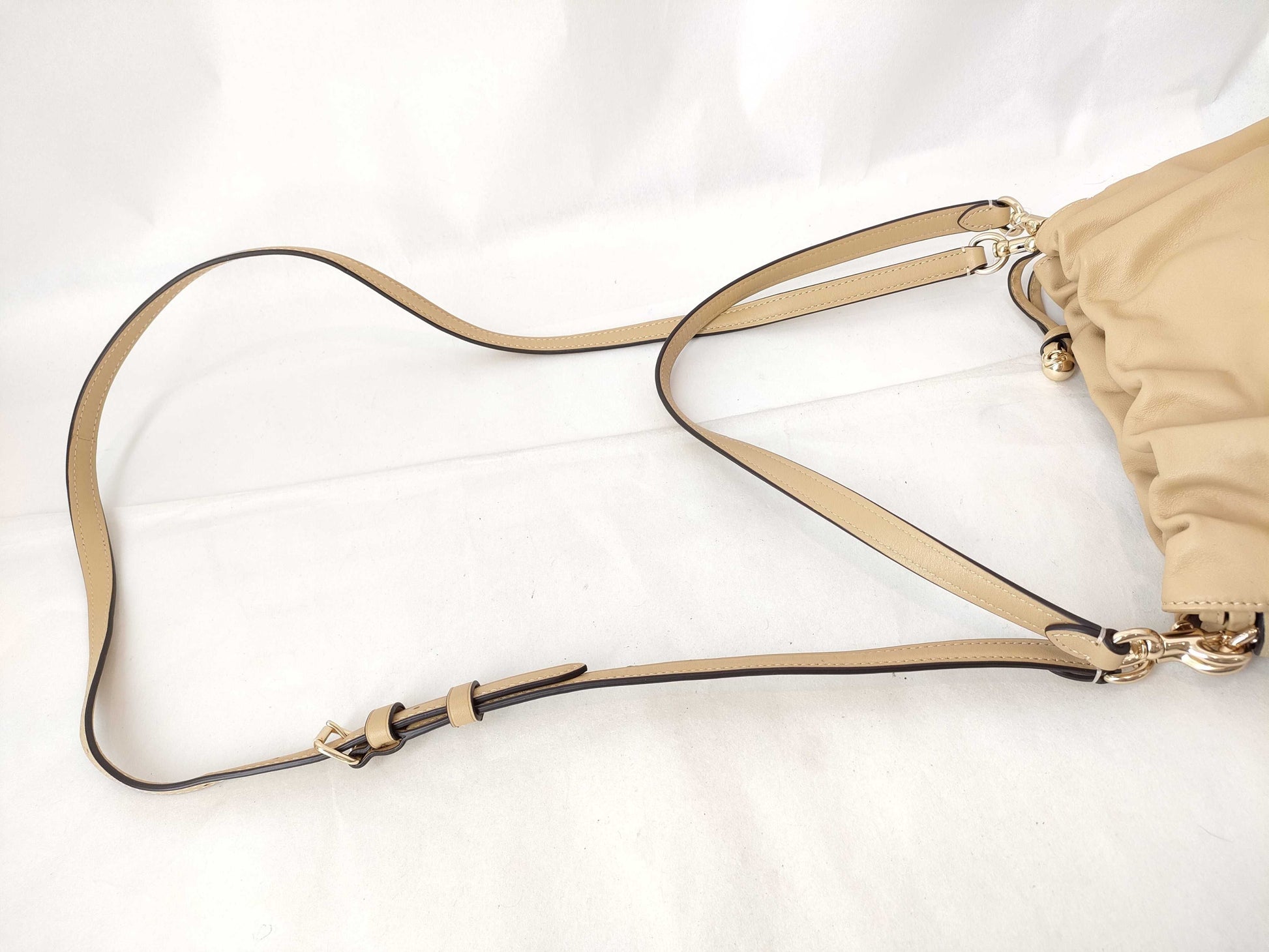 COACH Faye Drawstring Shoulder Bag in Beige Leather