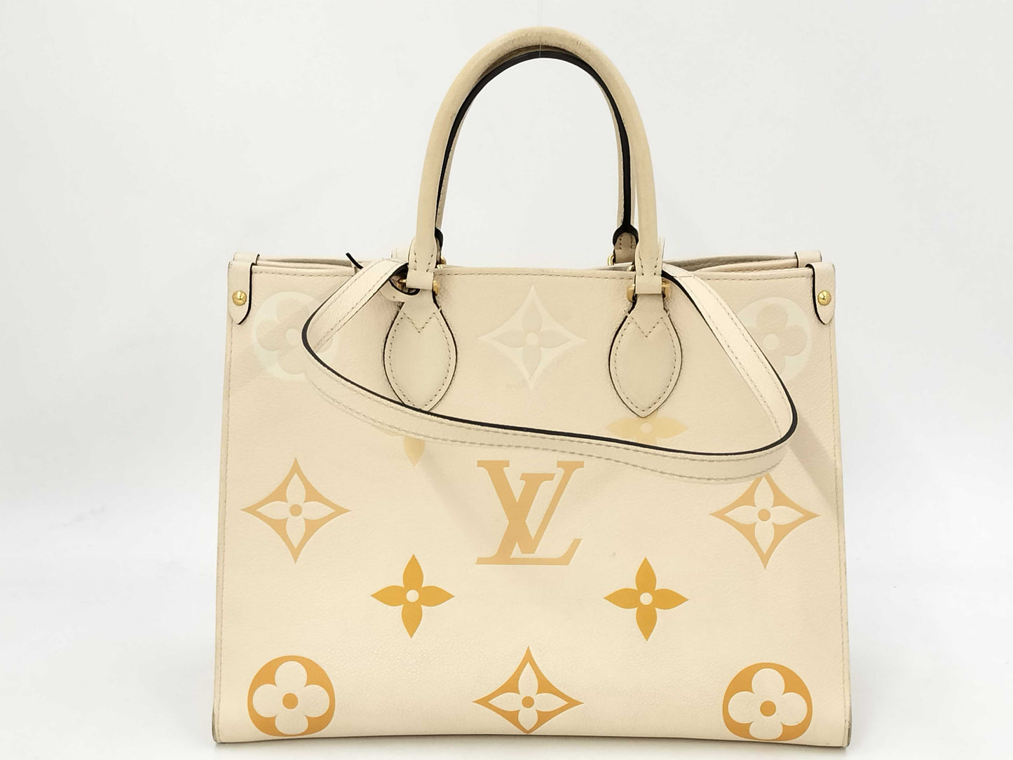 LOUIS VUITTON M45717 Monogram Empreinte On the Go MM Crème Saffron RFID Verified Tote Bag