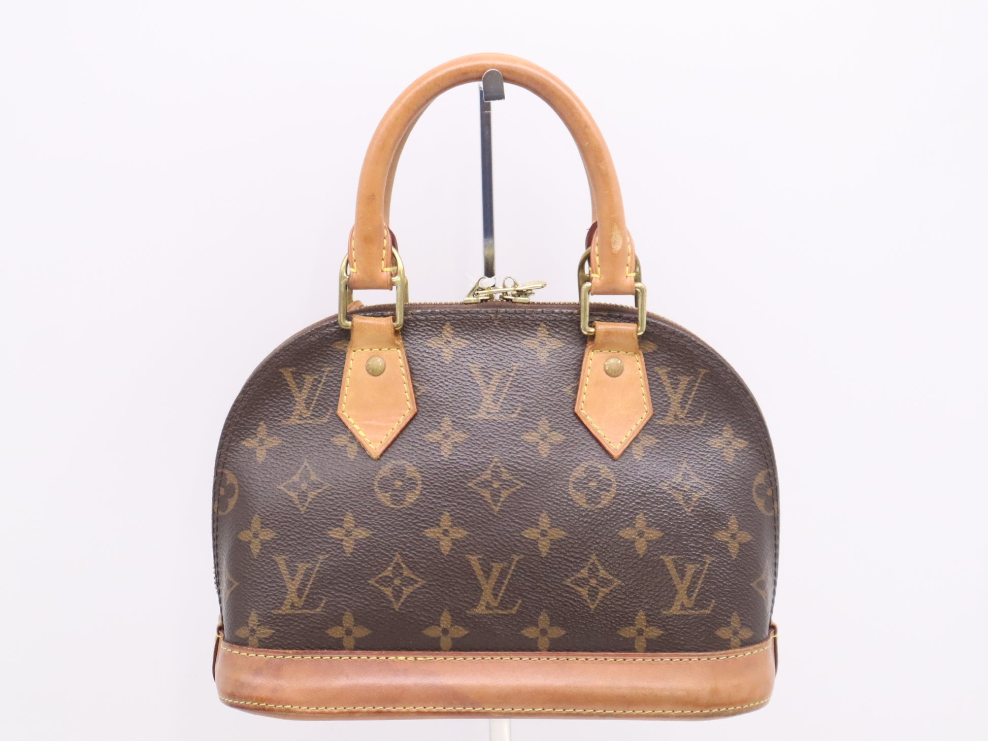 LOUIS VUITTON M53152 Monogram Alma BB Handbag with Shoulder Strap, Padlock, Two Keys, Cloche, and Dust Bag