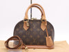 LOUIS VUITTON M53152 Monogram Alma BB Handbag with Shoulder Strap, Padlock, Two Keys, Cloche, and Dust Bag