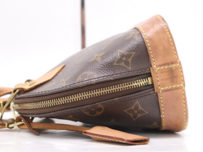 LOUIS VUITTON M53152 Monogram Alma BB Handbag with Shoulder Strap, Padlock, Two Keys, Cloche, and Dust Bag