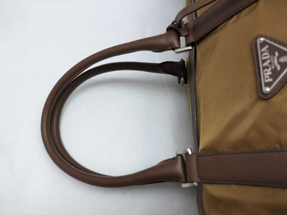PRADA V19S Triangle Logo Boston Bag in Tessuto Nylon and Saffiano Leather, Brown, Factory Tag 44, Zippered, with Factory Tag #44.
