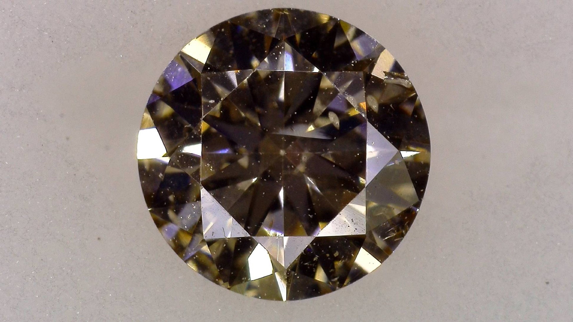 0.551ct UNDER S) LIGHT BROWN SI-2 VERY GOOD/GD/GD FAINT NATURAL 5.34-5.37X3.12mm Loose Diamond