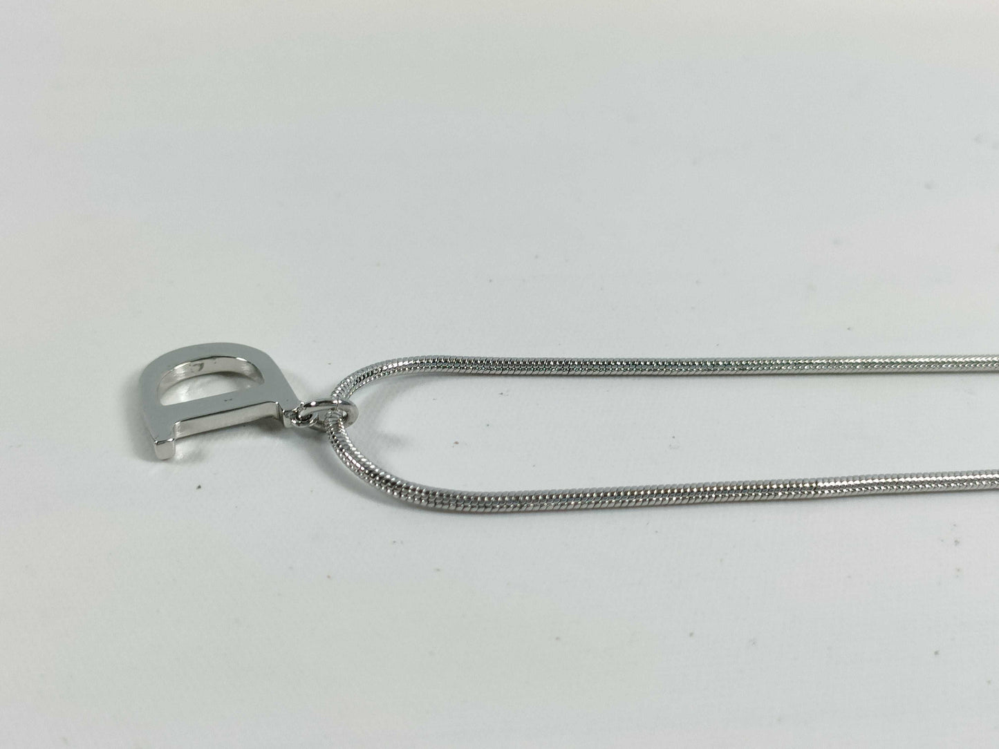 Dior D logo necklace