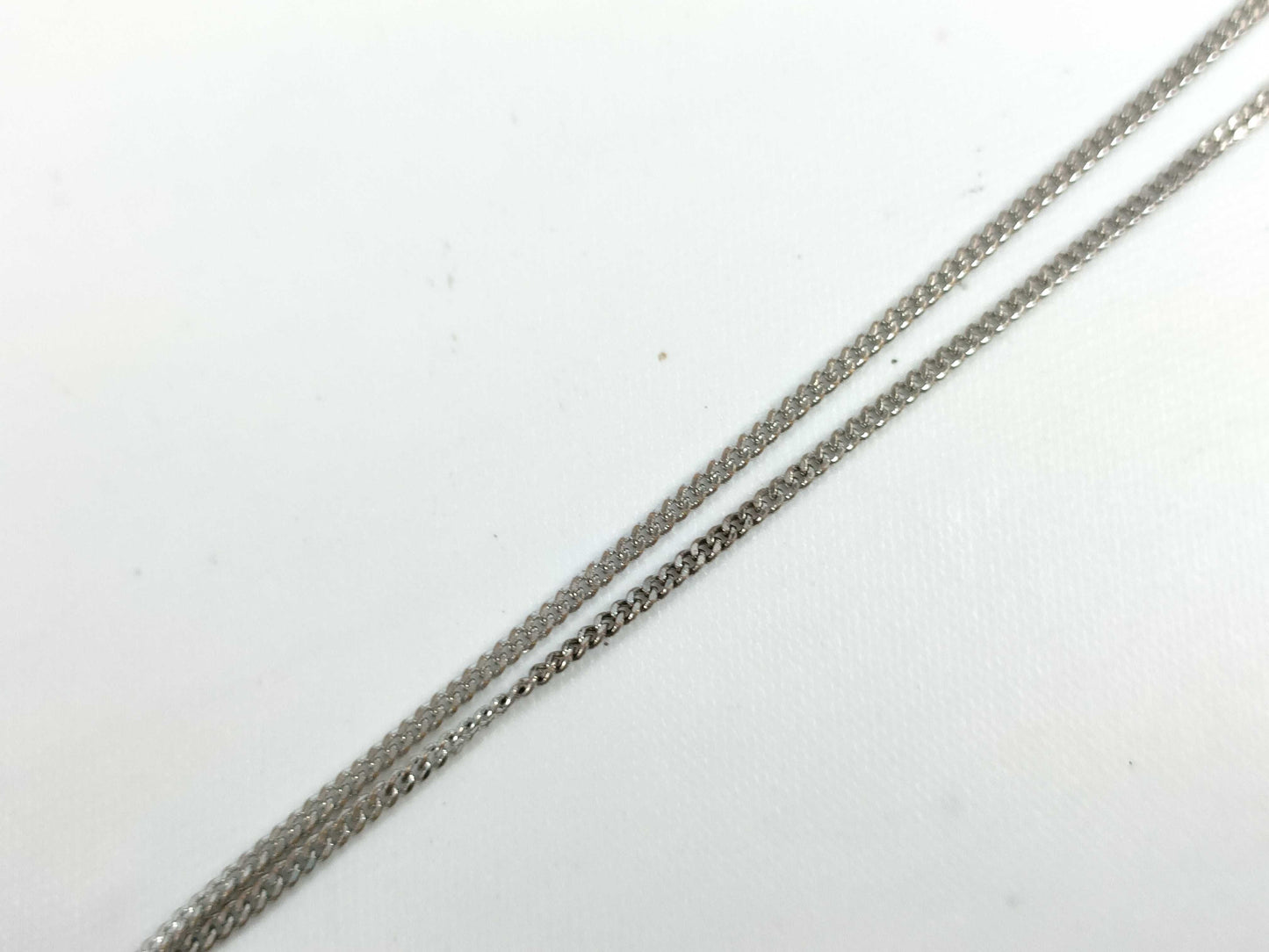 Dior D logo playing card plate necklace