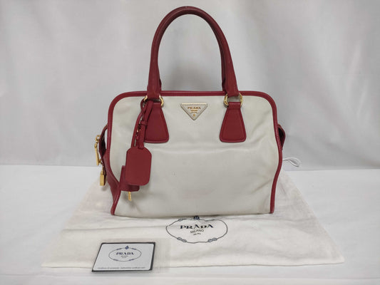 PRADA BN2578 Bicolor Saffiano Leather Handbag in Red and White, with Shinjuku Isetan Warranty, Cloche, and White Tag.