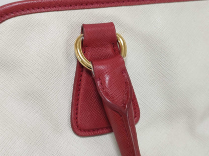 PRADA BN2578 Bicolor Saffiano Leather Handbag in Red and White, with Shinjuku Isetan Warranty, Cloche, and White Tag.