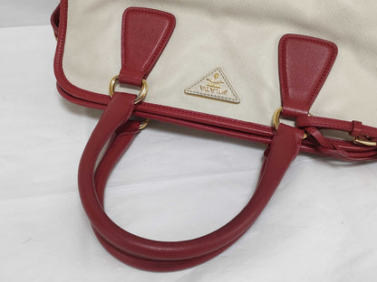 PRADA BN2578 Bicolor Saffiano Leather Handbag in Red and White, with Shinjuku Isetan Warranty, Cloche, and White Tag.