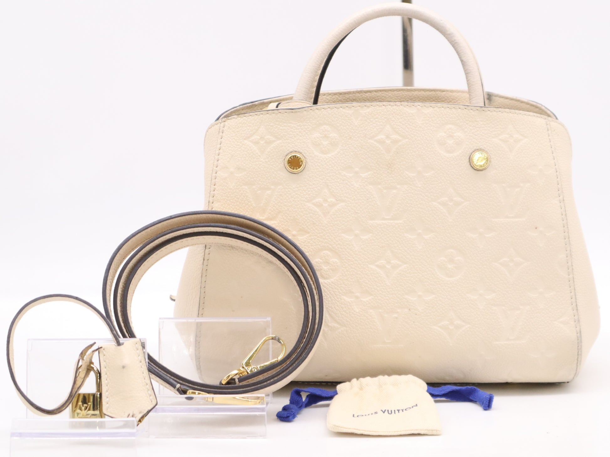 LOUIS VUITTON M50880 Empreinte Montaigne BB White Handbag with Shoulder Strap, Padlock, Two Keys, Cloche, and Poignier Closure