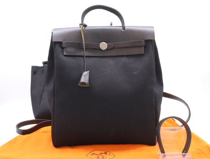 HERMES Toile Officier Air Bag, Ad PM, with padlock, two keys, clochette, and two dust bags, black, silver hardware, G stamp, 2003, handbag