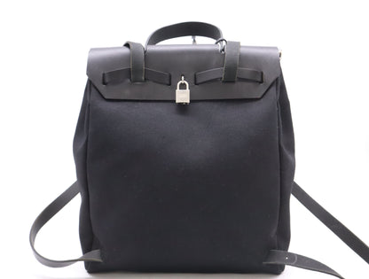 HERMES Toile Officier Air Bag, Ad PM, with padlock, two keys, clochette, and two dust bags, black, silver hardware, G stamp, 2003, handbag